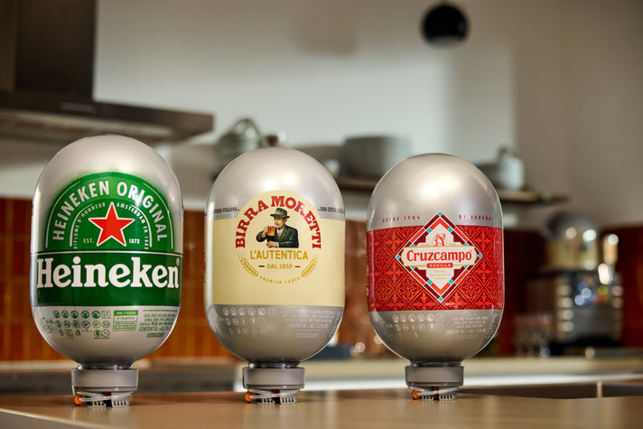 Three 8L Beer Kegs including Heineken, Birra Moretti, and Cruzcampo on a kitchen counter.
