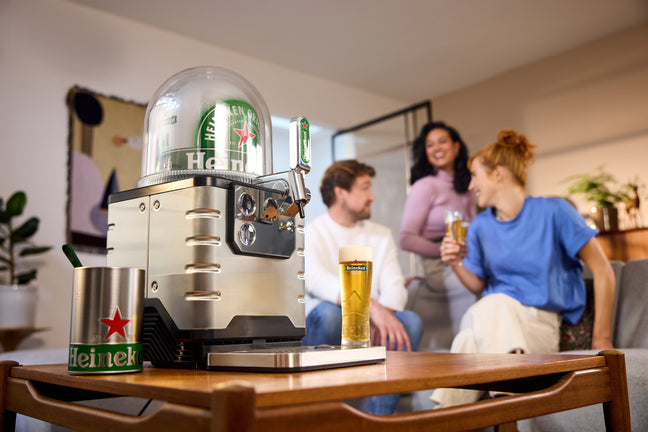 People enjoying Heineken beer freshly served from the Blade Beer Tap.