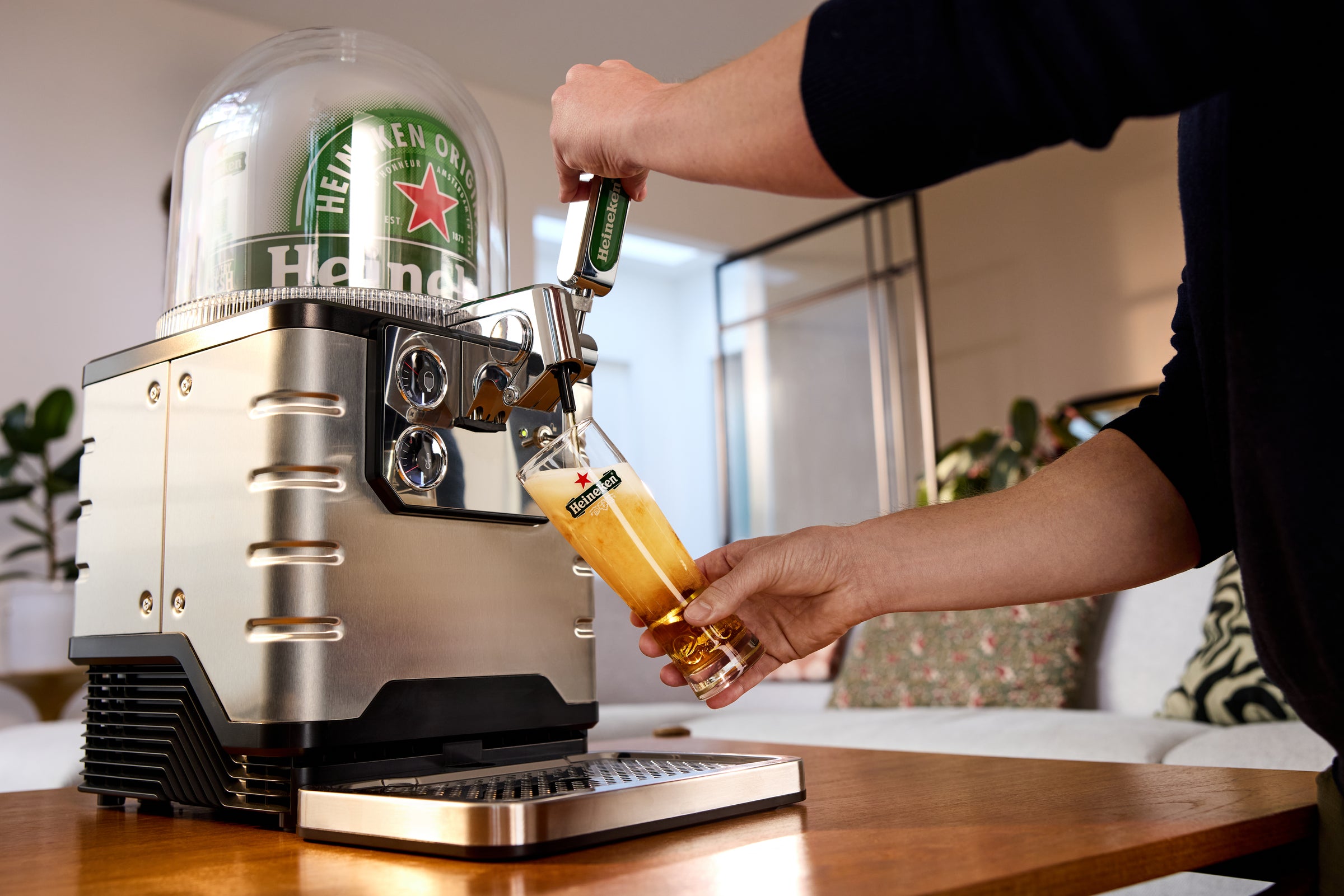 Heineken Being Poured from Blade Beer Tap in Living Room. Home Bar Draft Experience.