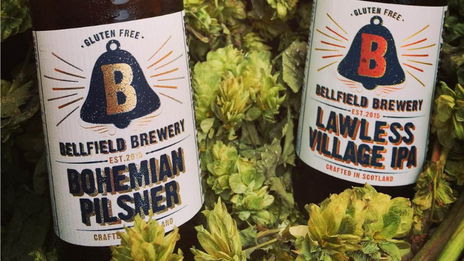 A close up shot of two bottles of beer from the Bellfield Brewery.