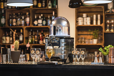 A BLADE beer machine with a Birra Moretti beer keg and glasses, placed on a counter in a bar or pub