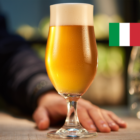 A full glass of golden beer with the flag of Italy in the top right corner.