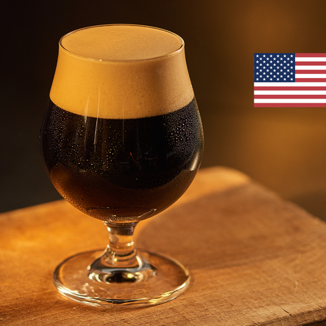 A full glass of dark beer with the flag of the United States of America in the top right corner.