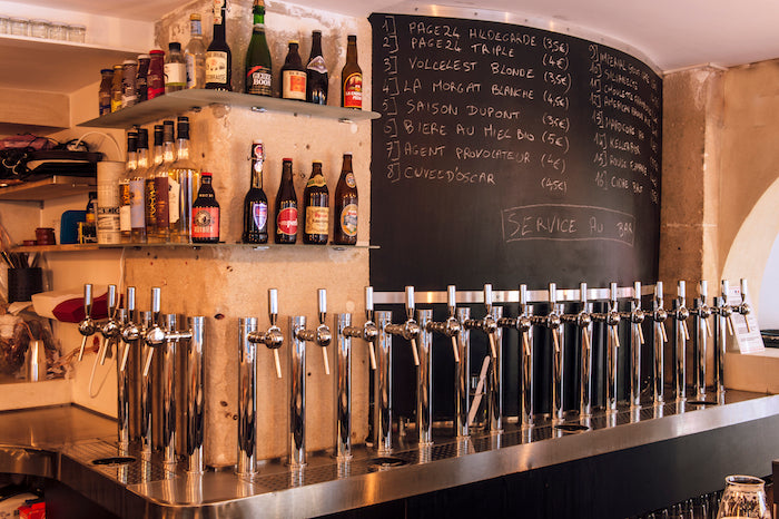 Interior view of La Fine Mousse, a stylish bar in Paris with a wide selection of beers on tap.