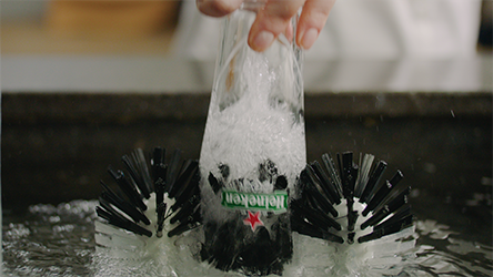Rinsing a beer glass thoroughly using a BLADE Glass Brush. This makes your glass slippery, eliminating friction and creating a uniform head.