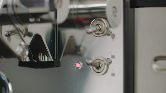 An image of flicking the switch down to lock the keg into your BLADE.